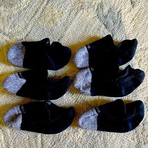 Three pairs of men’s Bombas no show socks.